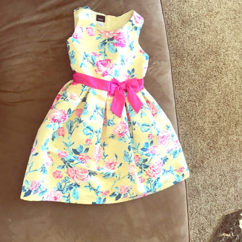 A yellow pink green flowery dress
